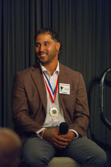 Ryan Mathews holding a microphone during a question and answer session