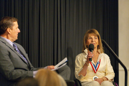 Marilyn Hamilton Speaking to the audience alongside interviewer Paul Loeffler