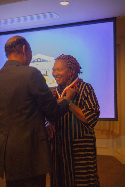 Ivy Nickolas medaled by Maxie Parks