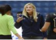 Vicki Samarin in discussion with her volleyball players during a match