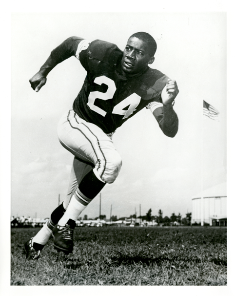 willie wood in jersey number twenty four running in his jersey on the football field